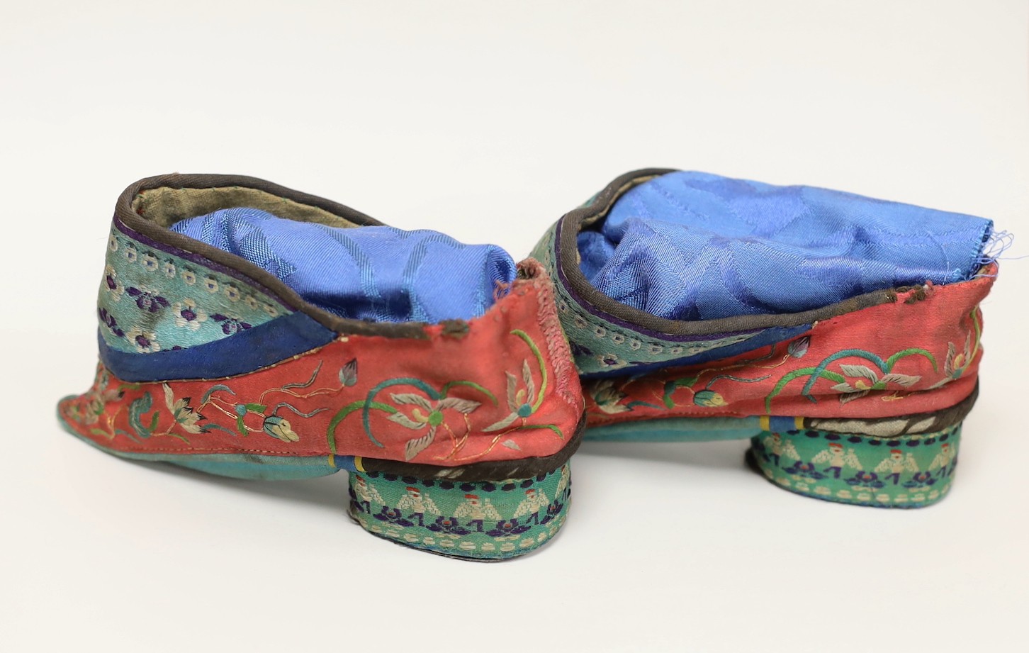 A pair of Chinese silk embroidered ladies shoes, for bound feet, 13cms wide